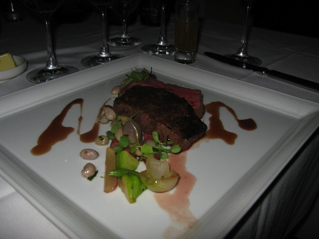 Bison Striploin Wild Boar Summer Sausage, Breakfast Radishes, Romesco Beans, Pearl Onions, Paddy Pans